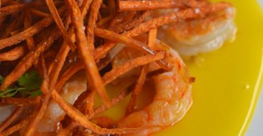 brennans_brunch_egg-yolk-carpaccio-with-grilled-shrimp-crispy-sweet-potato-andouille-vinaigrette1-web